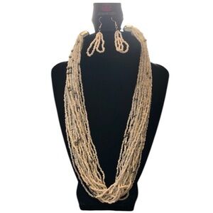 White seeded beads silver tone necklace and matching pierced earrings.